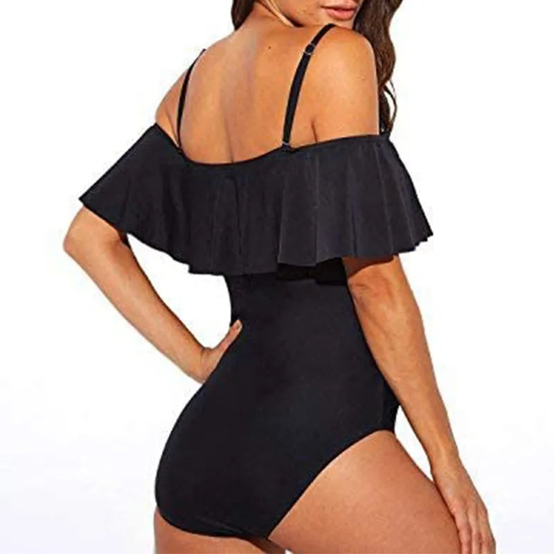 Black one-piece swimsuit with ruffled straps and side cut-out details