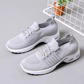 Women's black mesh casual sneakers with round toe and white non-slip PVC sole on a light background.