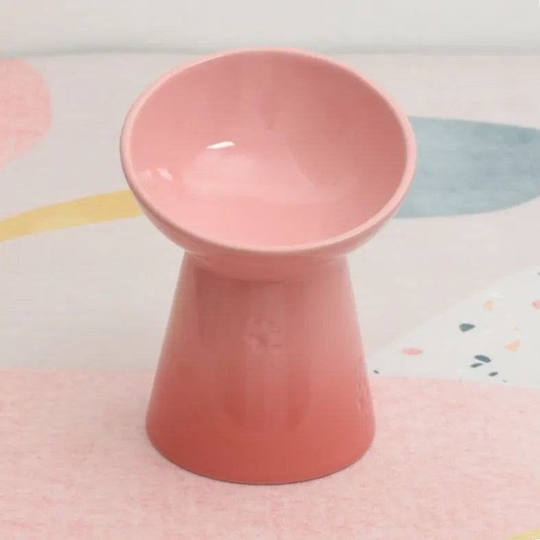 Ceramic pet bowl with high foot design showing anti-tumble stability feature