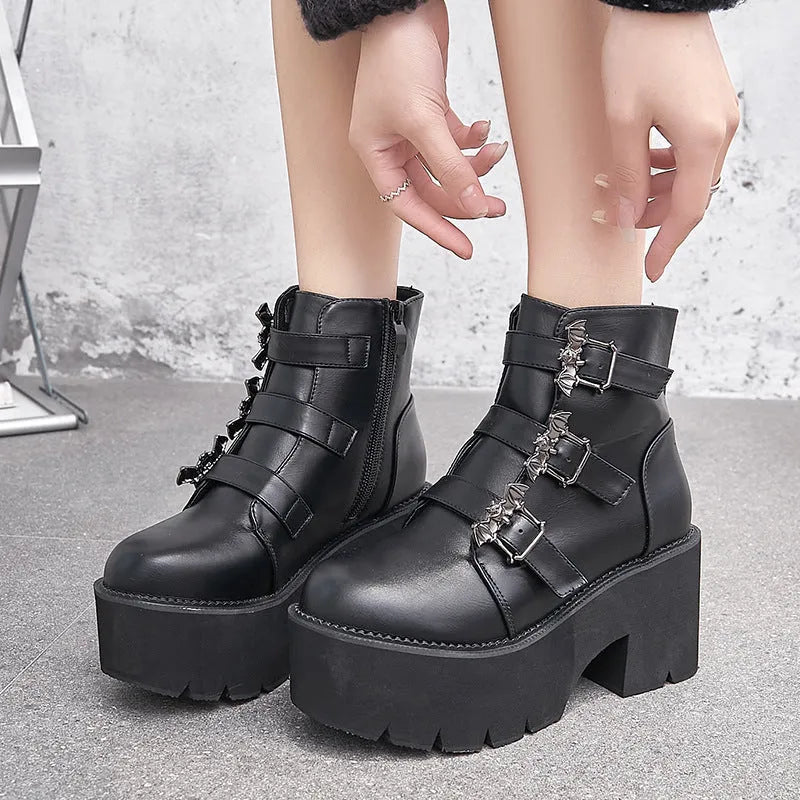 Women's black Harajuku punk ankle boots with bat buckle, side zip, and thick heel.
