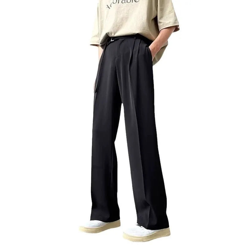 Black loose-fit wide-leg trousers with straight cut on a hanger.