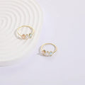 Geometric triangular copper women's ring with tricolour zircon stones and electroplated gold colour finish
