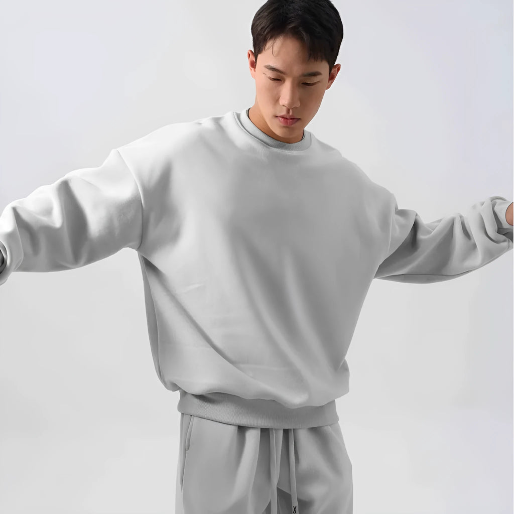 Men's loose fit polar fleece sports suit in army green, showing jacket and trousers.