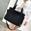 Women's large capacity canvas crossbody tote bag with organiser pockets in black colour