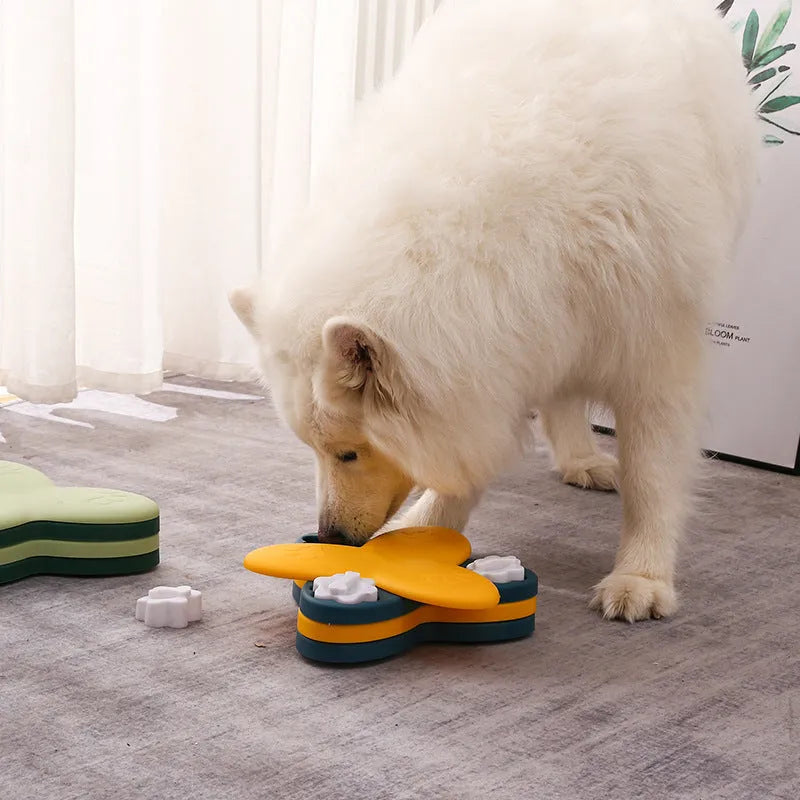 Green dog puzzle toy with bone-shaped lids and non-slip base for treat dispensing