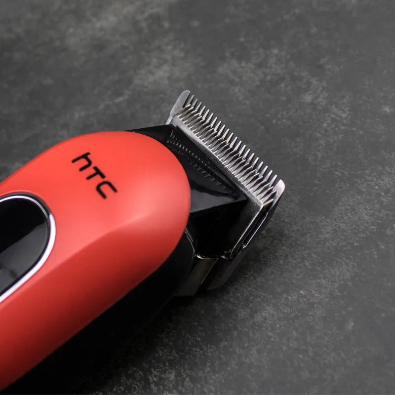 Professional digital electric hair clipper with four limiting combs, available in black, red, and white colours.