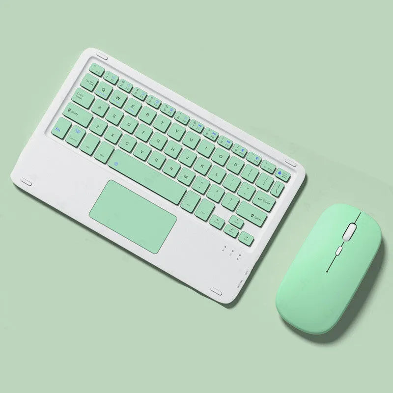 Pink wireless Bluetooth touch keyboard and rechargeable mouse combo on a white desk.