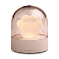 Grey and pink cat paw shaped USB rechargeable night light with music box on a desk