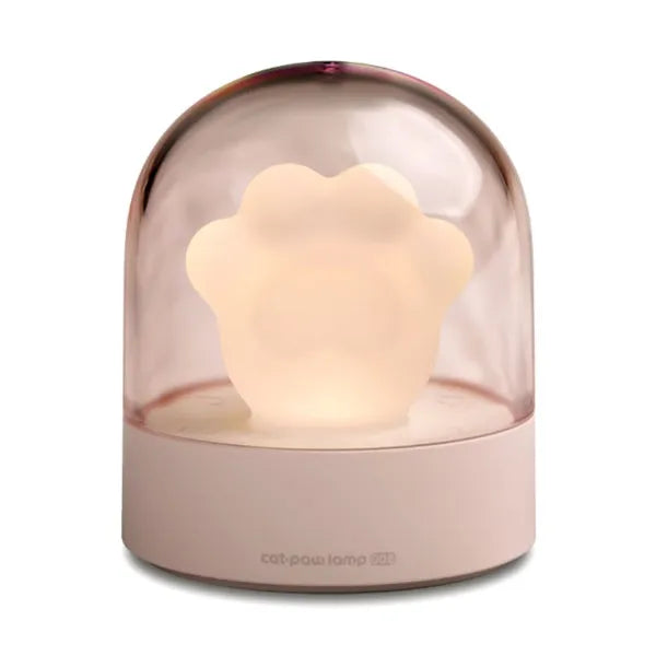 Grey and pink cat paw shaped USB rechargeable night light with music box on a desk