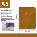 A5 leather notebook with metal coil binding showing multiple colour options including black, blue, brown, and green.