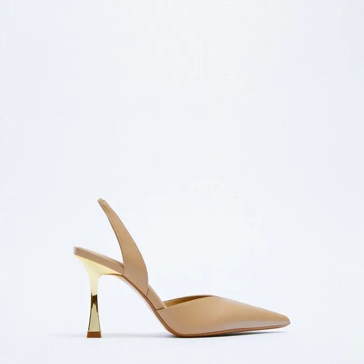 Women's pointed patent leather high heels in nude apricot colour with a shallow mouth design.