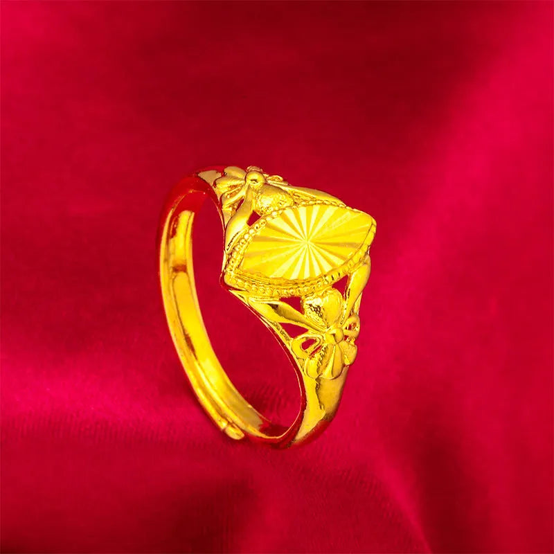 Gold electroplated open flower ring with geometric texture on adjustable brass band