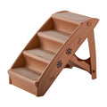 Foldable plastic pet ladder with non-slip mat for small dogs and cats next to a sofa