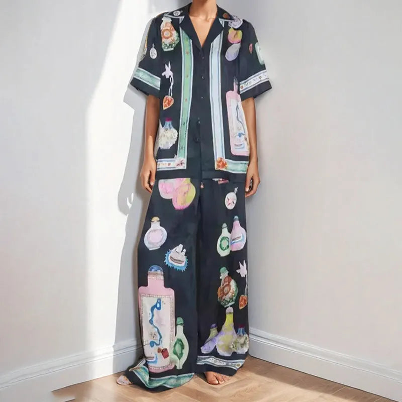Black women's cardigan and pants set with cartoon animation print.