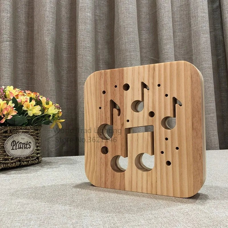 Square wooden USB LED atmosphere light with laser-cut design glowing warm white.