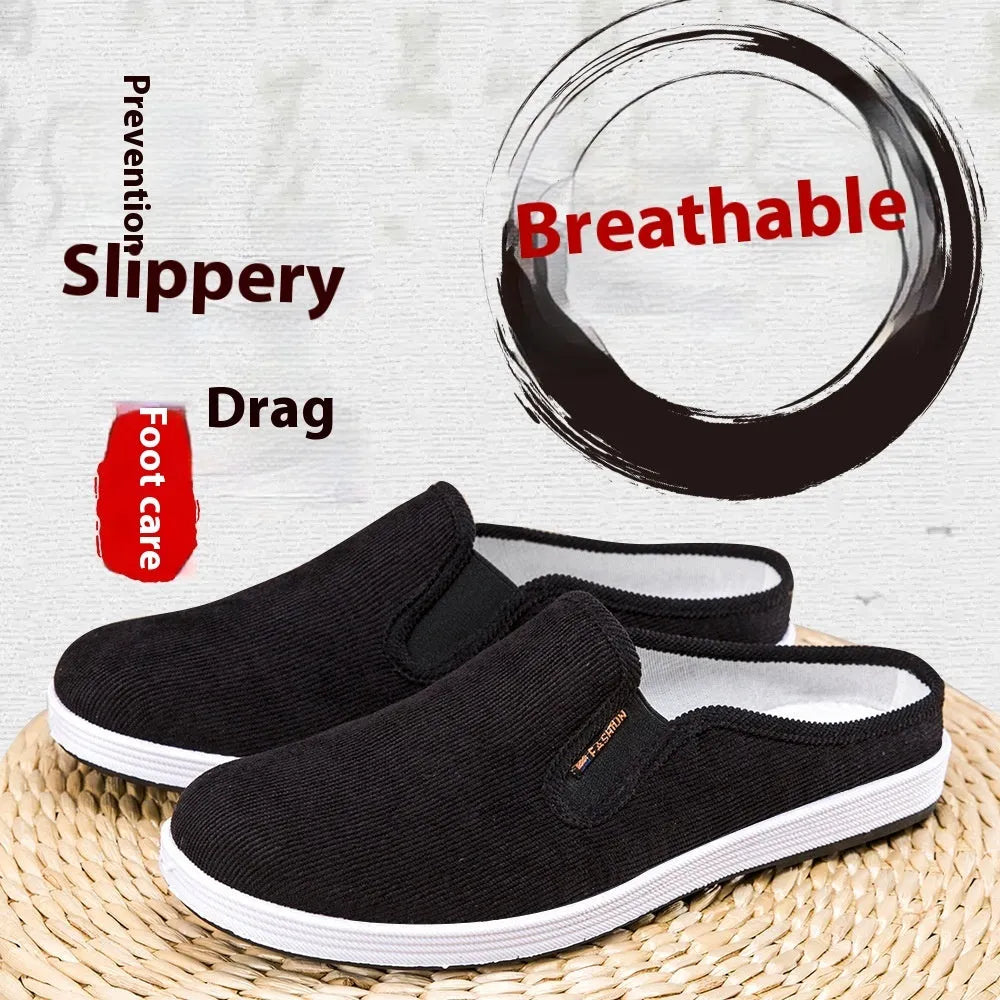 Men's casual slip-on sneakers in black with non-slip rubber sole and mesh lining