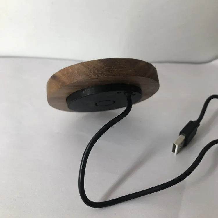 60mm round wireless charging pad for embedding into furniture surfaces with USB cable connection