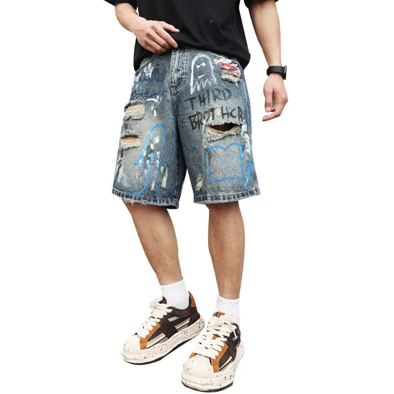 Blue men's ripped denim shorts with graffiti details and a straight leg opening.