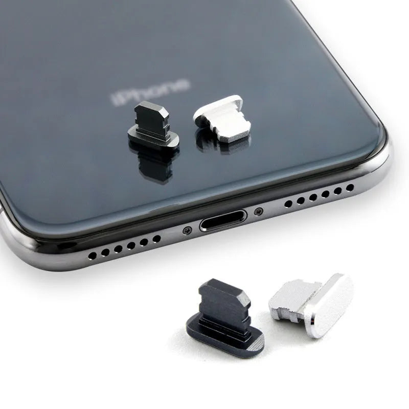 Aluminium alloy dust plug for iPhone charging port in a selection of colours including gold, silver, and rose gold.