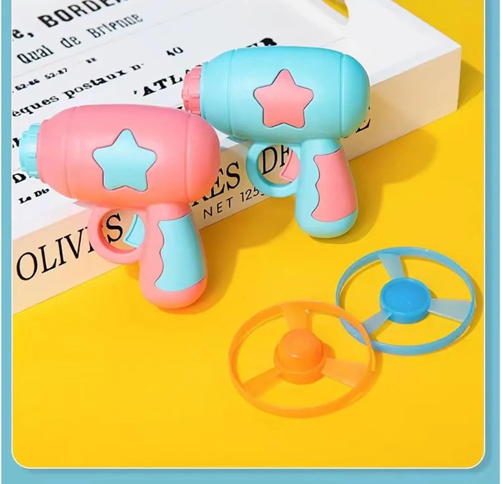 Blue plastic cat toy gun with spinning frisbee launch mechanism for indoor cats