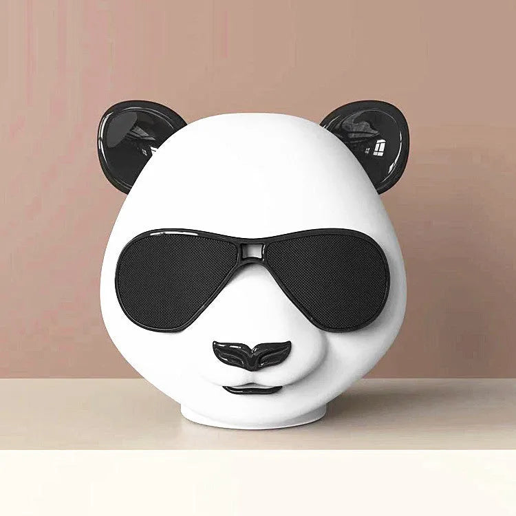 Classic style portable mini Bluetooth speaker on a surface, showing its compact design.