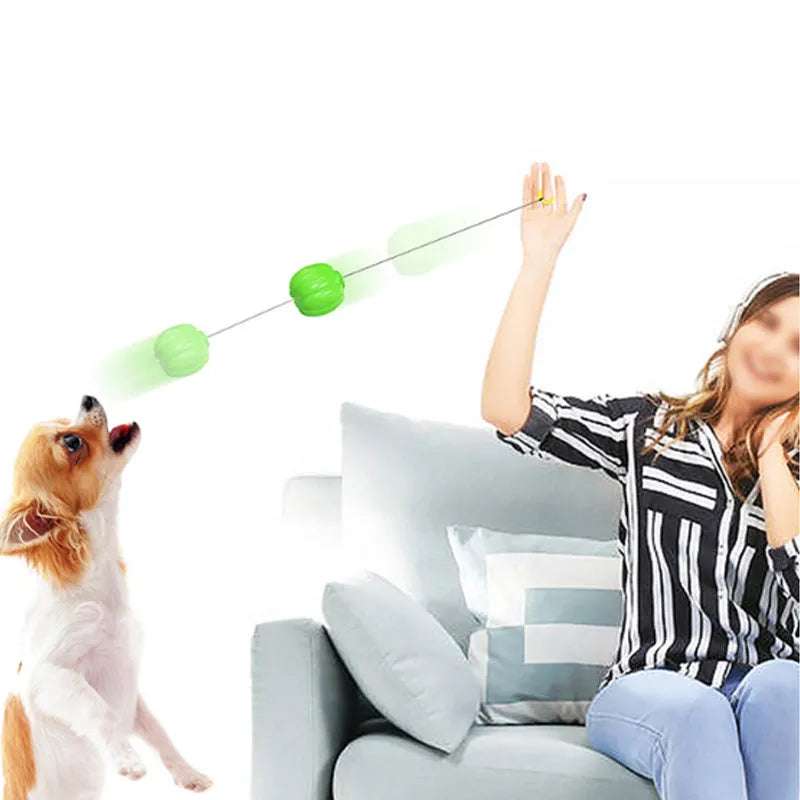 Green, orange, and yellow plastic pumpkin-shaped dog toy ball with squeaker for small dogs.