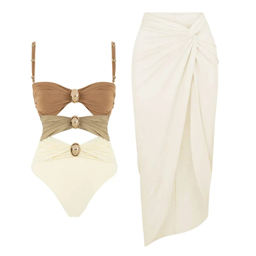 Women's solid-colour one-piece swimsuit with gold buttons and a matching skirt in assorted colours.