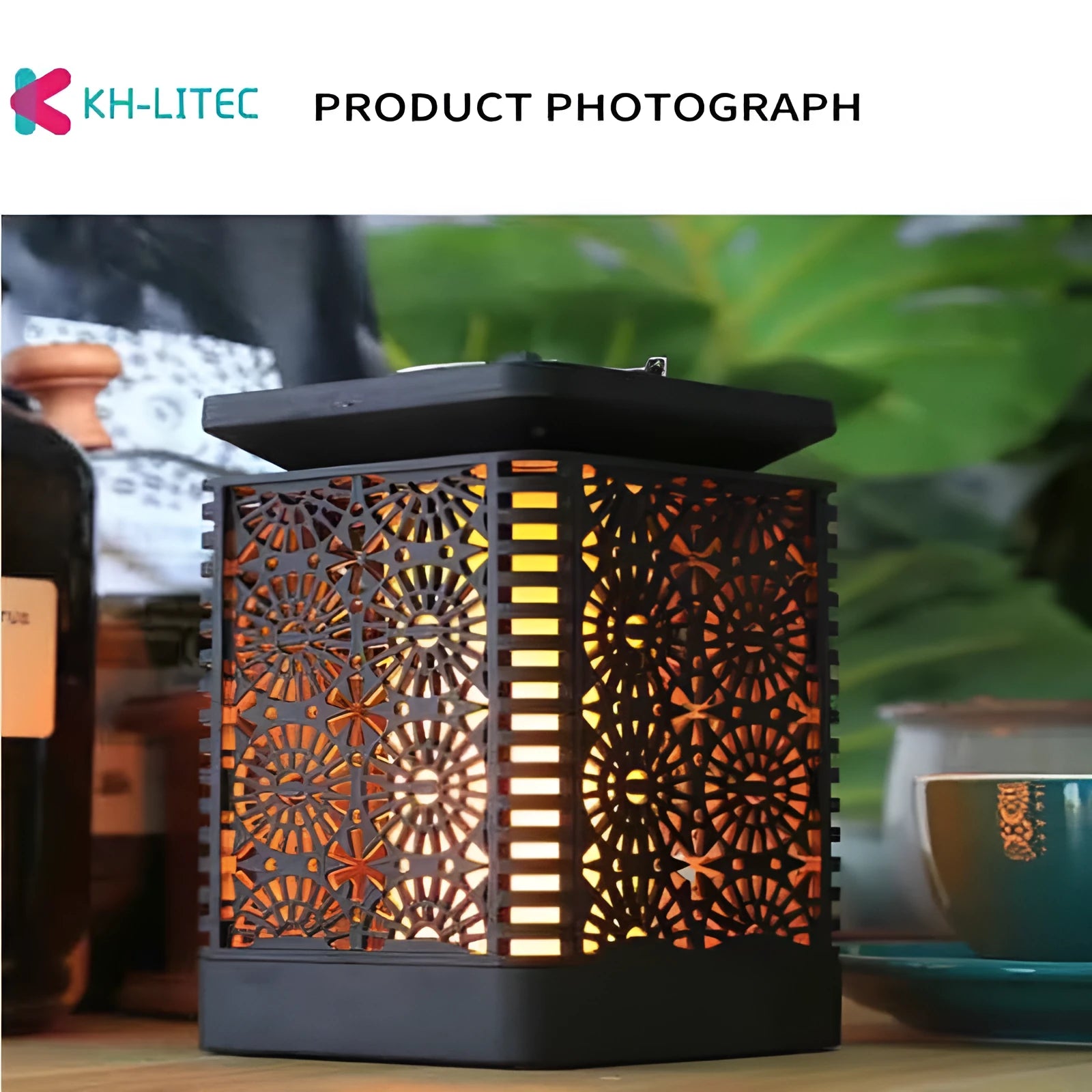 Four black solar-powered hanging torch lights with flickering flame LED effect for garden decoration