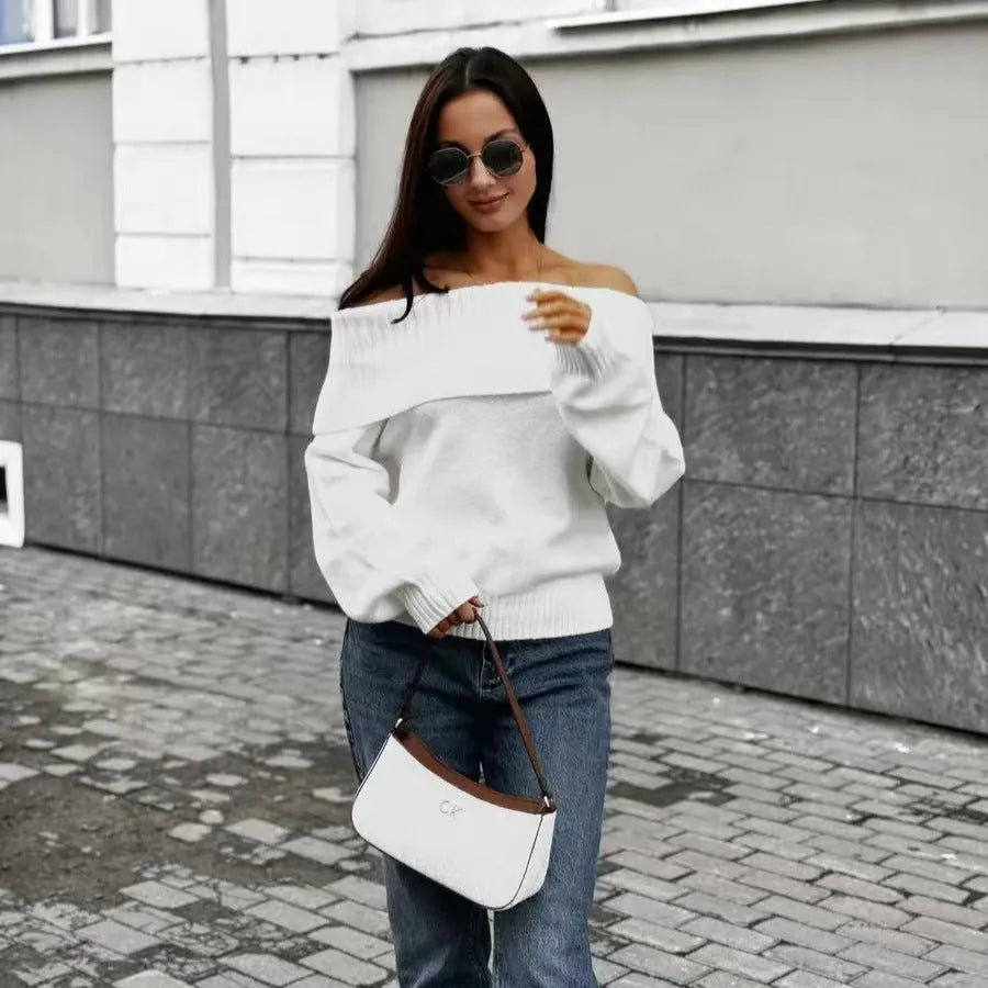 Grey strapless off-the-shoulder acrylic sweater with a 3D pattern, shown as a pullover.