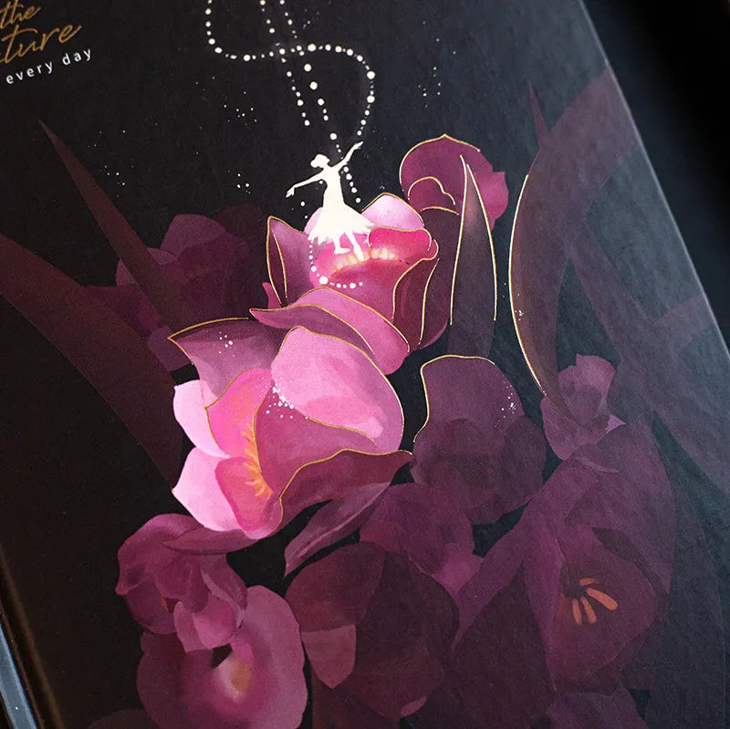 A5 notebook with luminous cover open to show pages filled with colour illustrations