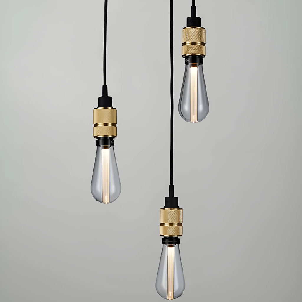 DIY retro chandelier assembly kit components showing braided cord, lamp holder, and hardware in chrome finish
