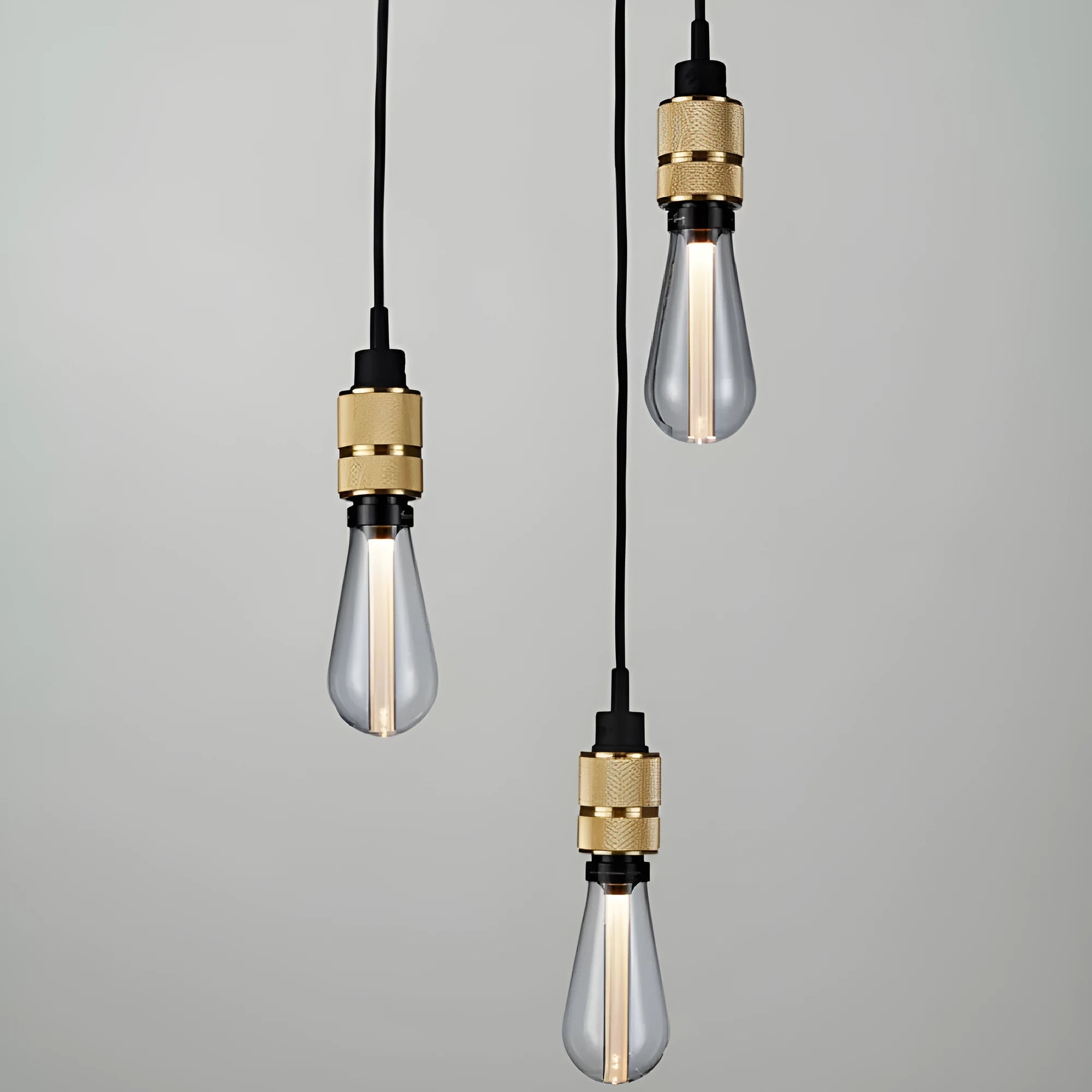 DIY retro chandelier assembly kit components showing braided cord, lamp holder, and hardware in chrome finish