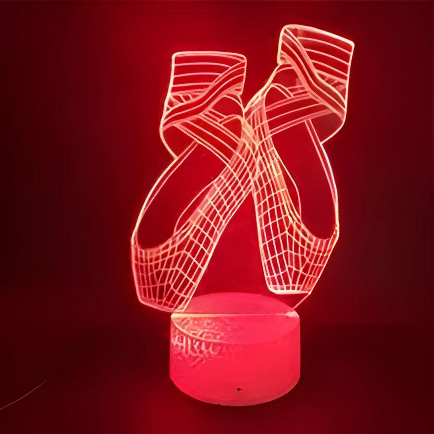 3D acrylic ballet dancer LED night light with remote control on an ABS base, showing colourful illumination.