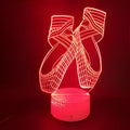 3D acrylic ballet dancer LED night light with remote control on an ABS base, showing colourful illumination.