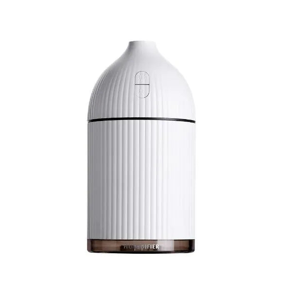 White ultrasonic aromatherapy diffuser with 300ml capacity, USB port, and LED light on wooden surface