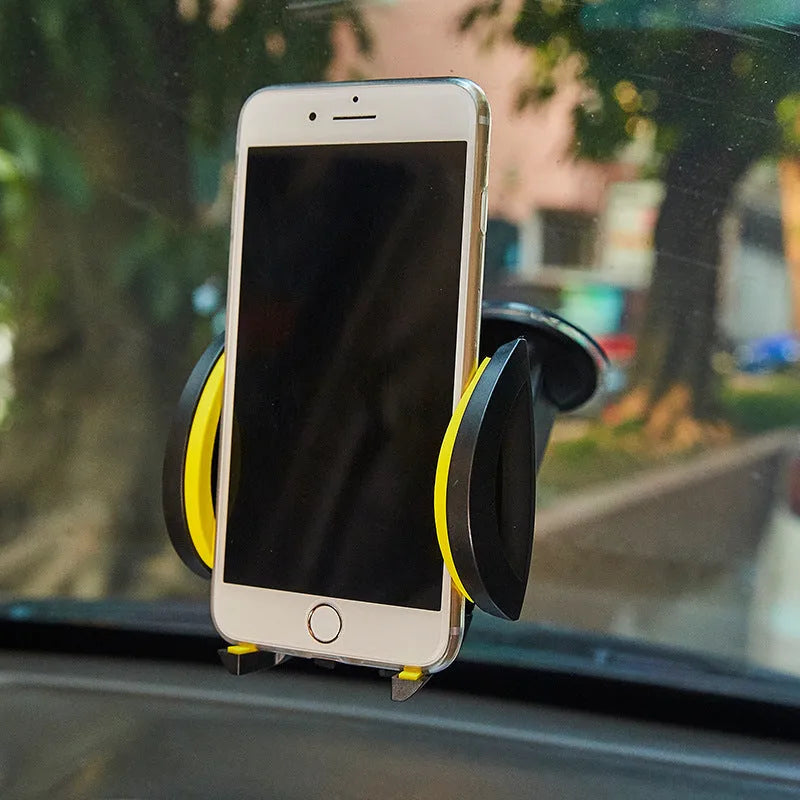 Red ABS car phone holder with U-shaped design and suction cup base on a vehicle dashboard
