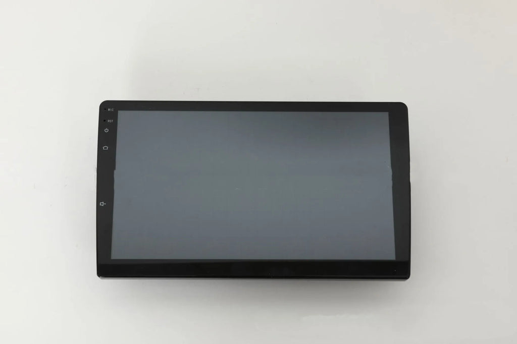 10.1 inch Android universal car machine with trapezoid panel and connection ports visible