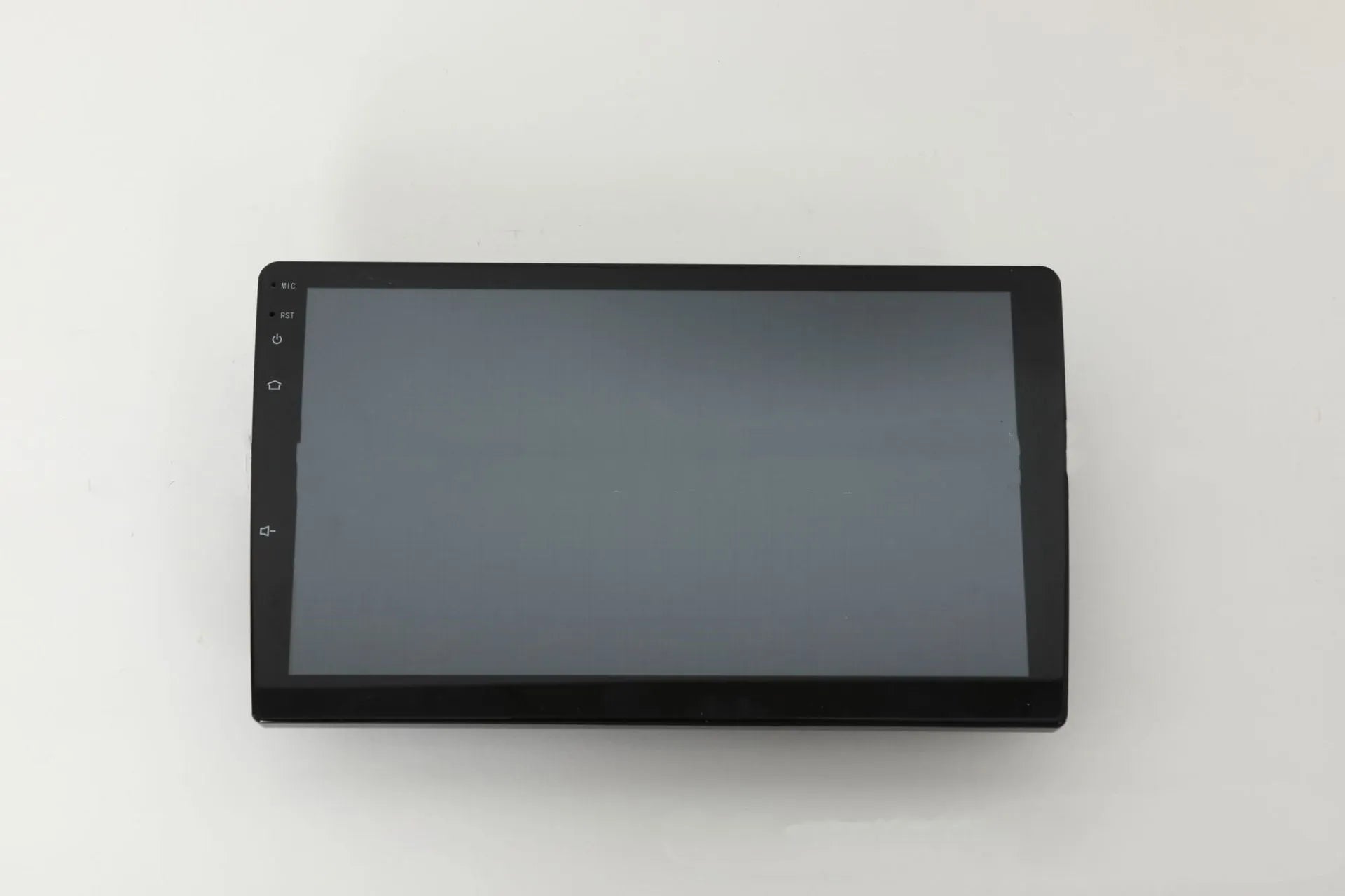 10.1 inch Android universal car machine with trapezoid panel and connection ports visible