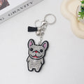 Cartoon French dog rhinestone keychain with alloy tassel in caramel colour