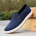 Men's black and blue canvas slip-on shoes with round toe and composite sole