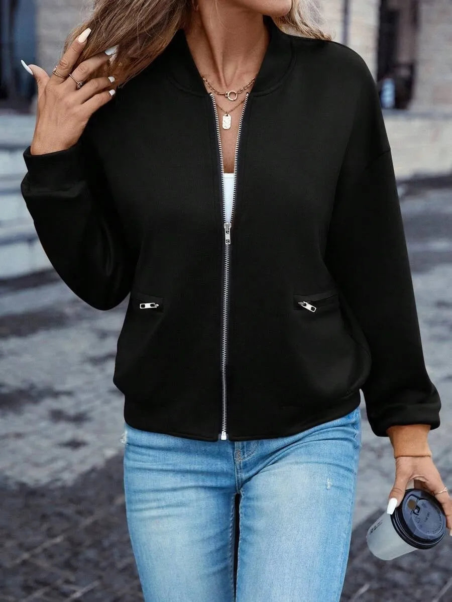 Black women's zip-front casual jacket with long sleeves on a hanger.