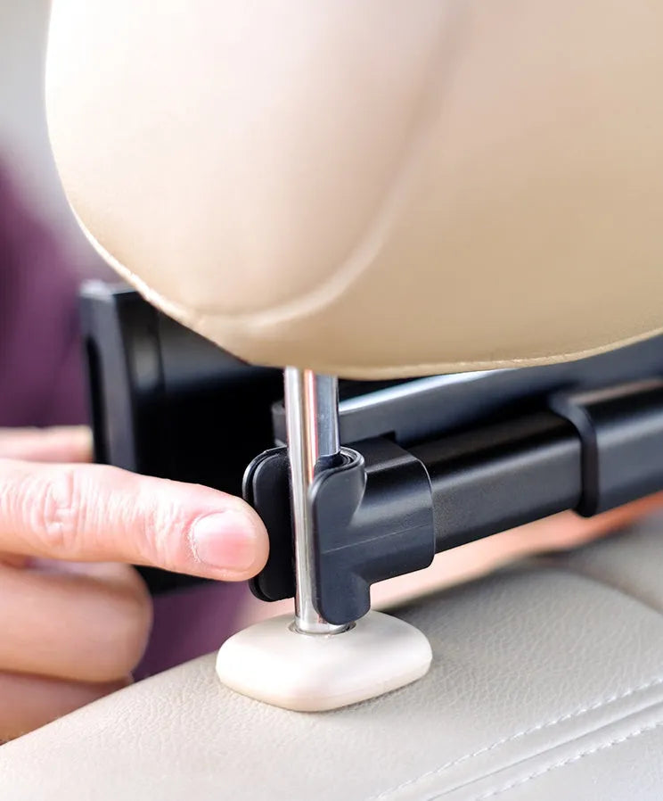 Black universal car phone holder mounted on rear seat base holding a tablet