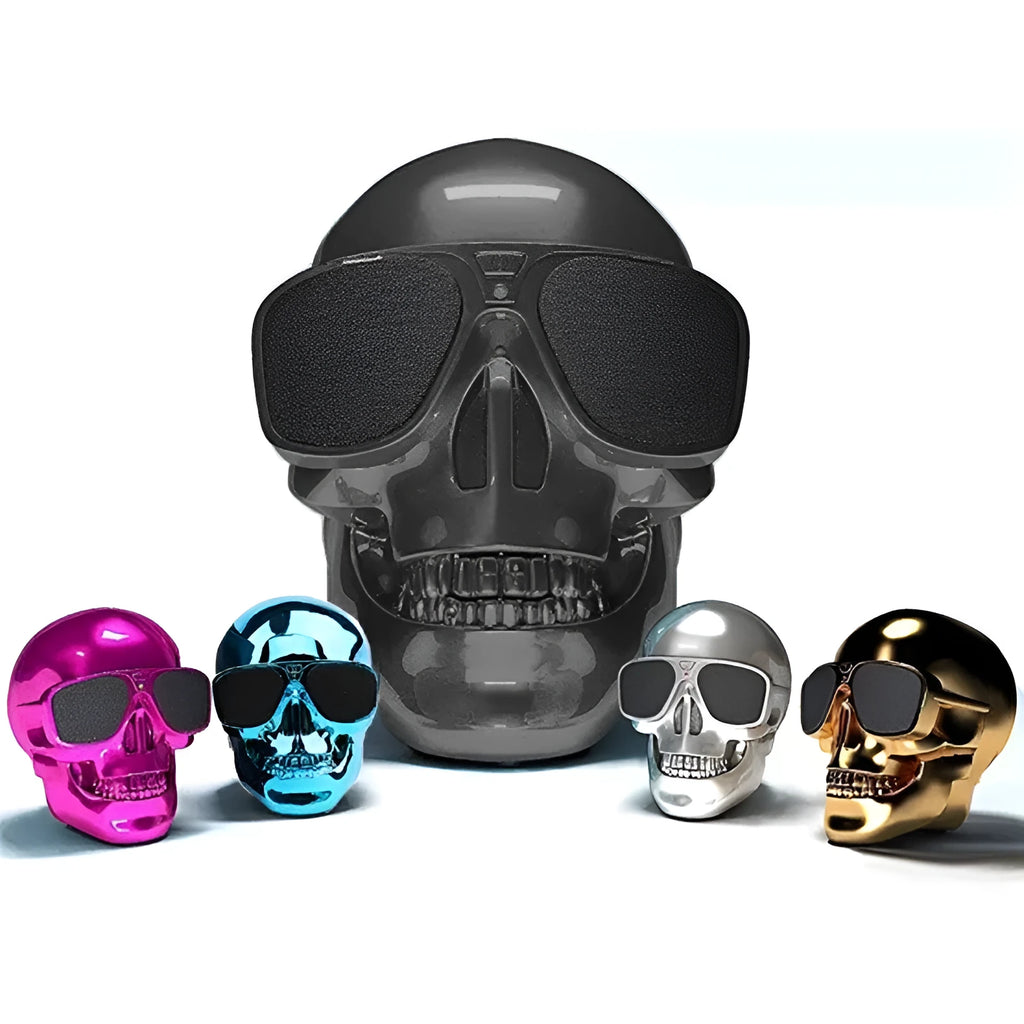 Skull-themed portable wireless Bluetooth speaker in choice of six colours on a table.