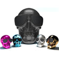 Skull-themed portable wireless Bluetooth speaker in choice of six colours on a table.