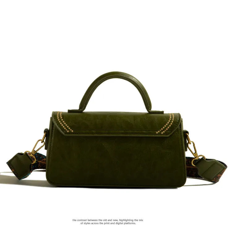 Women's retro brown messenger bag with square design showing sewing thread detailing and outer sandwich pocket