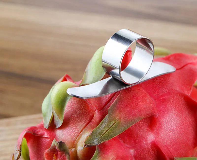 Silver stainless steel orange peeler ring on a citrus fruit