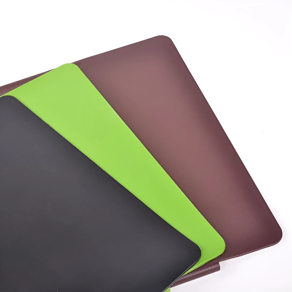 Large black PVC computer desk mat 700x450x3mm with non-slip base on a wooden desk