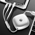 Black retractable 3-in-1 USB charging cable extended to 1.2 metres with titanium alloy connectors.