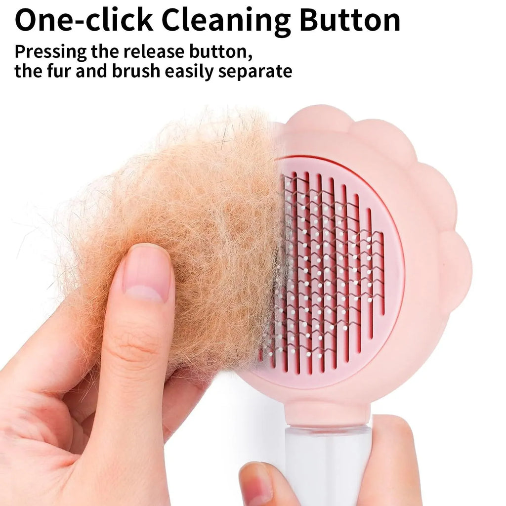 Grey pet grooming brush with self-cleaning button and water spray function on a white background