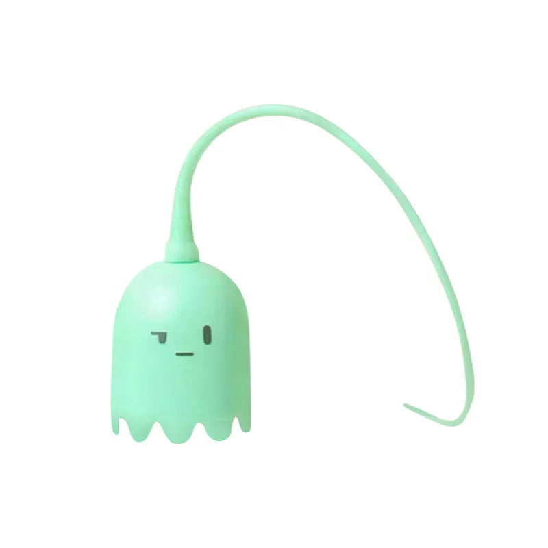 Green automatic cat wand toy with swinging silicone tails on wooden floor